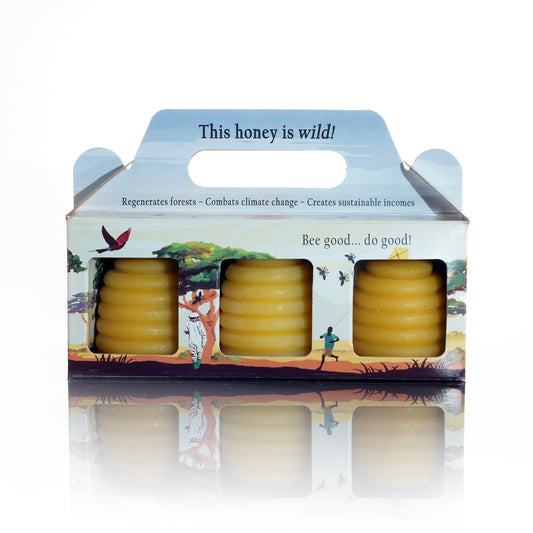 A set of small beeswax candles crafted in the shape of beehives, ideal as a thoughtful gift.